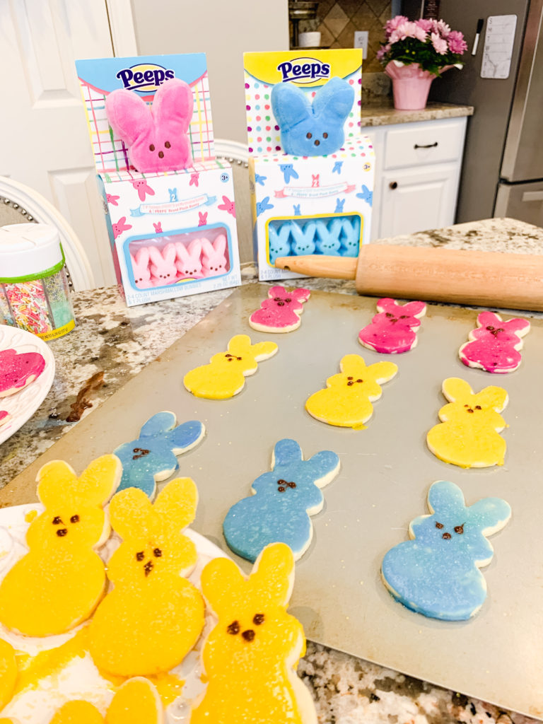 Brianna K's easter cookies shaped like Peeps bunnies in the kitchen with sugar cookie icing that hardens and sprinkles. Brianna K Bitsofbri bits of bri blog easter cook recipe butter cookie cut out cookie sugar cookie recipe icing that hardens peeps bunnies bunny easter cookie recipe 2019
