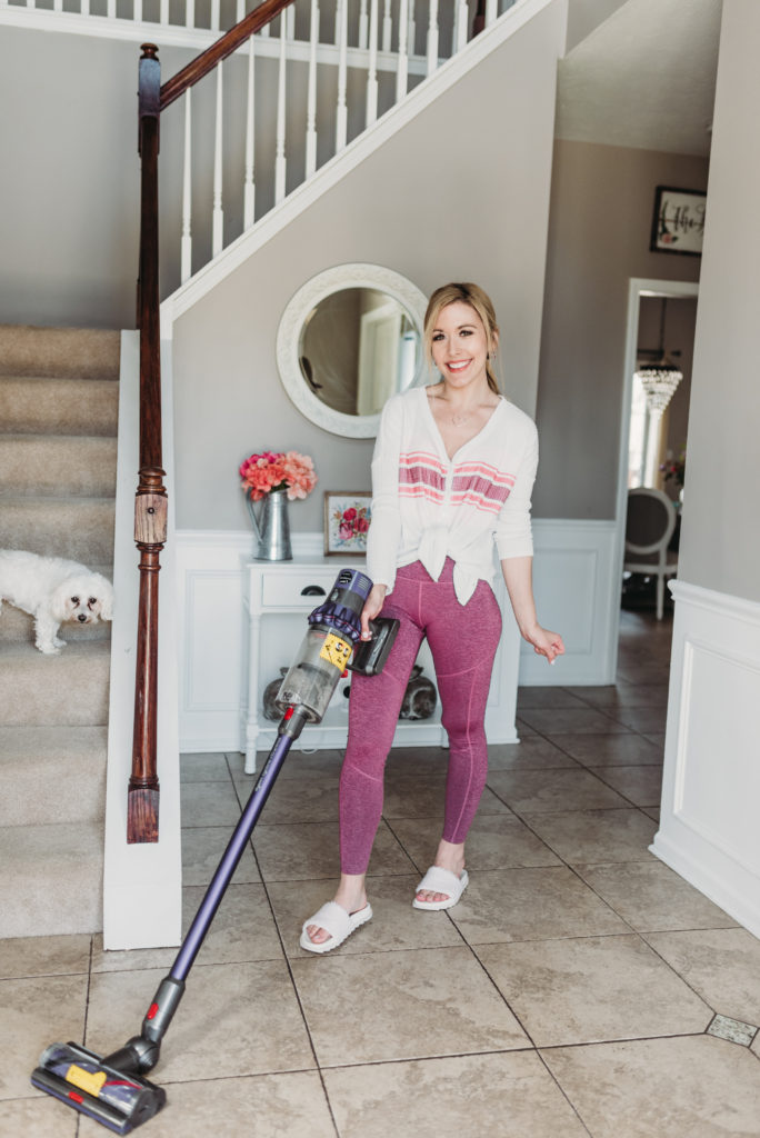 Brianna K cleaning her foyer with her purple Dyson vacuum and cleaning motivation rose gold tumbler cup clean with me spring cleaning check list bits of bri blog 
