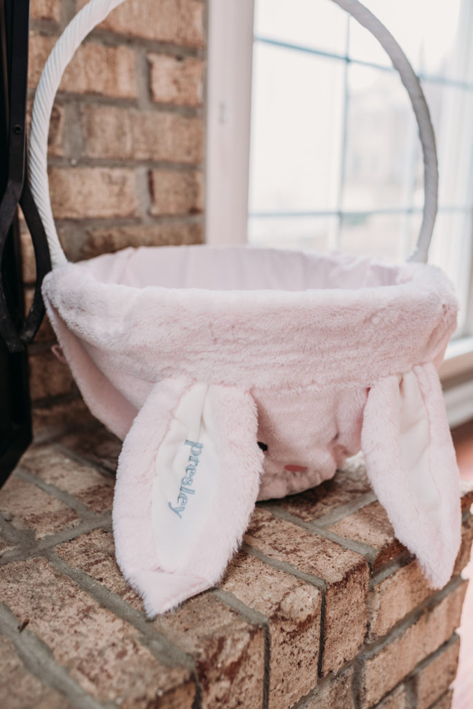 pink fur liner in white large basket from pottery barn kids  Brianna K bits of bri bitsofbri easter decor house tour 2019 spring and easter decorations around her home flowers bunnies dollar tree DIY decorations 