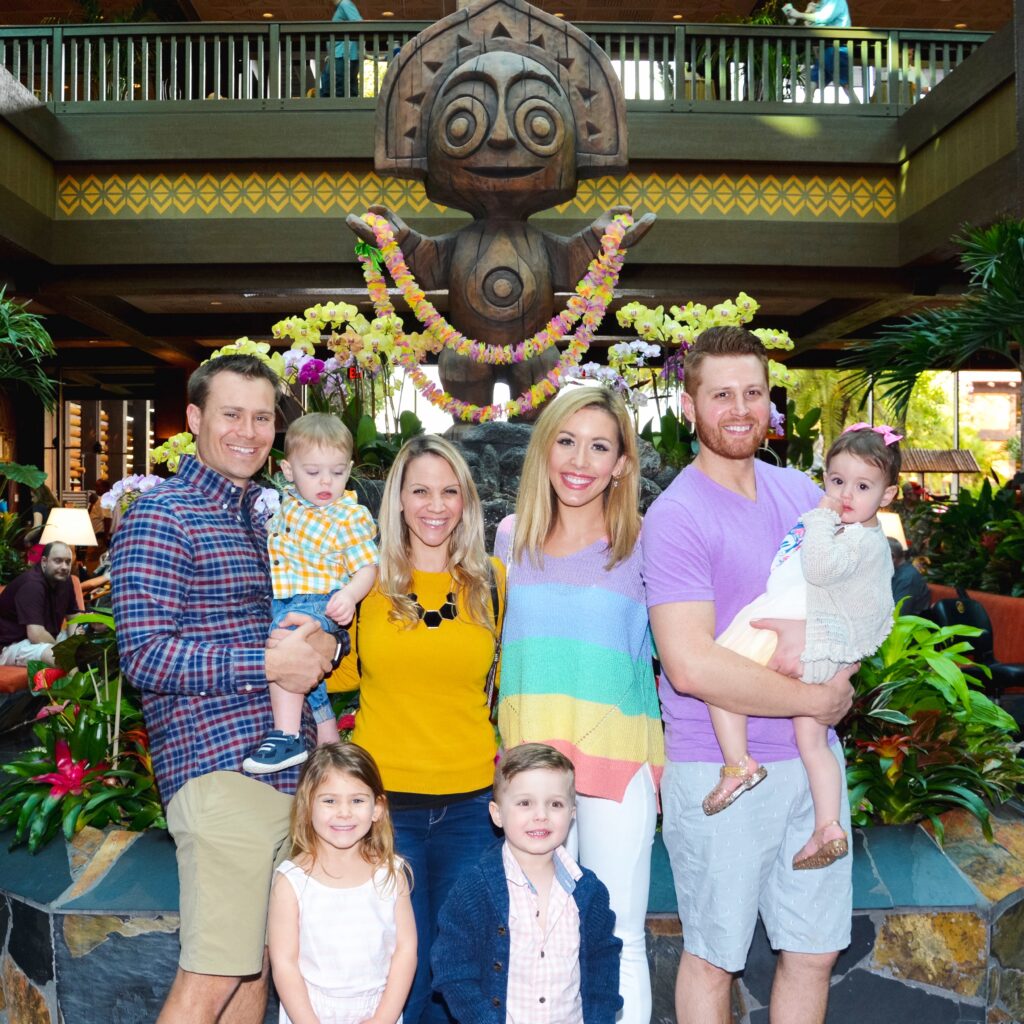 Brianna K with her husband Adam, son Landon, daughter Presley, best friend Deena from ABCDeeLearning.com , with her Husband Scott, daughter Carli, and son Lucas in the lobby at the Polynesian Resort before going to dinner at Ohana at Walt Disney World. 